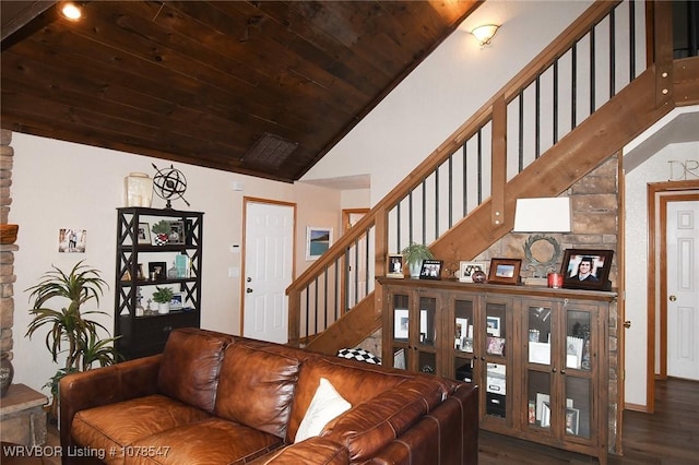 living room featuring dark hardwood / wood-style flooring, wood ceiling, and lofted ceiling