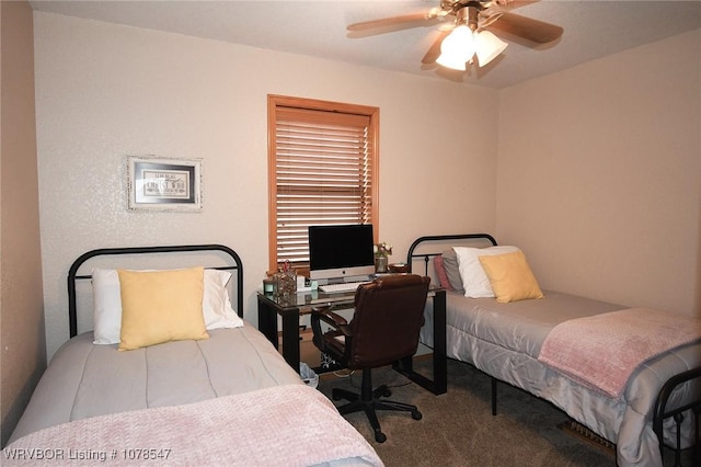 bedroom with ceiling fan and carpet