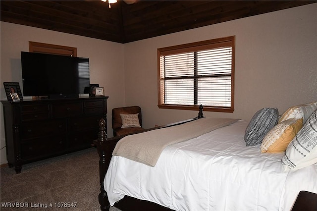 bedroom featuring carpet flooring and vaulted ceiling