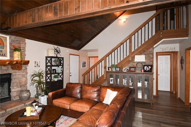 living room with a fireplace, dark hardwood / wood-style flooring, vaulted ceiling, and wooden ceiling