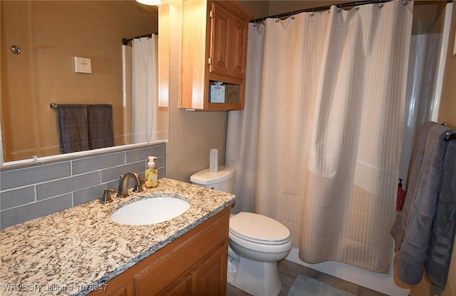 bathroom featuring vanity, decorative backsplash, curtained shower, and toilet