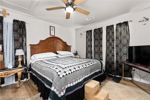 bedroom featuring ceiling fan and light hardwood / wood-style flooring