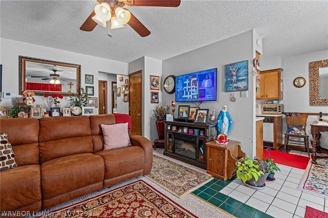 living room with tile patterned flooring and a textured ceiling