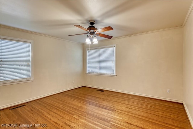70 Haven Dr, Fort Smith, AR 72901 - spare room featuring a ceiling fan, wood finished floors, baseboards, and crown molding