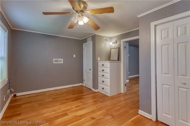 70 Haven Dr, Fort Smith, AR 72901 - unfurnished bedroom featuring light wood-style flooring, a closet, baseboards, ceiling fan, and crown molding