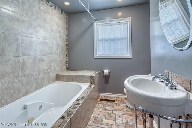 70 Haven Dr, Fort Smith, AR 72901 - full bathroom featuring a tub with jets, baseboards, stone tile floors, and recessed lighting