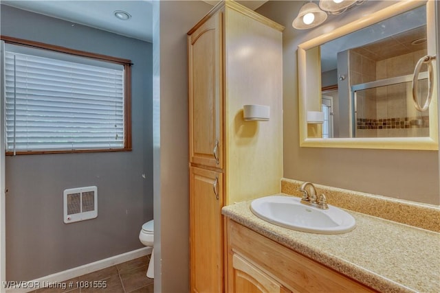 70 Haven Dr, Fort Smith, AR 72901 - full bathroom featuring vanity, toilet, tile patterned flooring, a tile shower, and heating unit