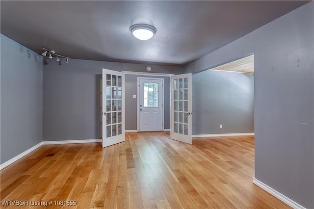 70 Haven Dr, Fort Smith, AR 72901 - entryway with french doors, light wood-style floors, and baseboards