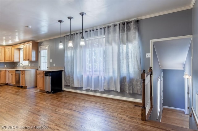 70 Haven Dr, Fort Smith, AR 72901 - kitchen with light countertops, dishwasher, light brown cabinetry, light wood finished floors, and crown molding
