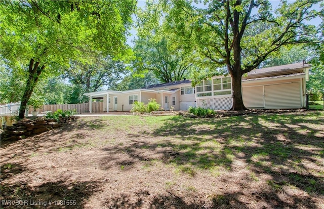70 Haven Dr, Fort Smith, AR 72901 - view of yard featuring a carport and a sunroom