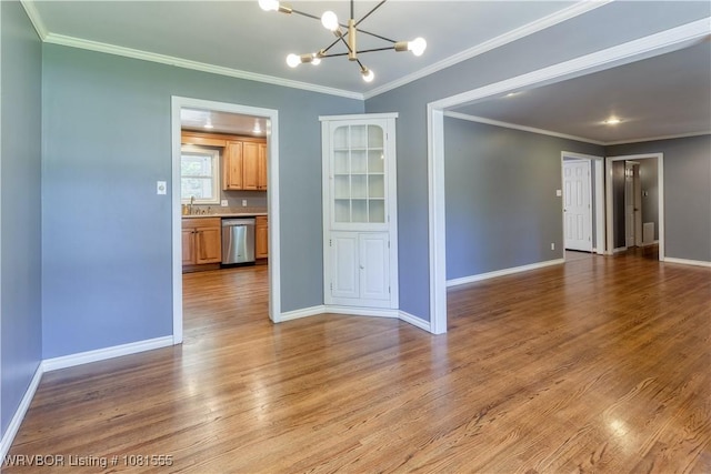 70 Haven Dr, Fort Smith, AR 72901 - empty room with a sink, wood finished floors, a chandelier, baseboards, and ornamental molding