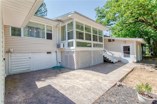 70 Haven Dr, Fort Smith, AR 72901 - back of property featuring a sunroom, a patio, and cooling unit