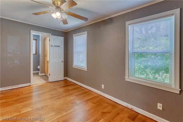 70 Haven Dr, Fort Smith, AR 72901 - empty room with light wood-style flooring, ceiling fan, crown molding, and baseboards