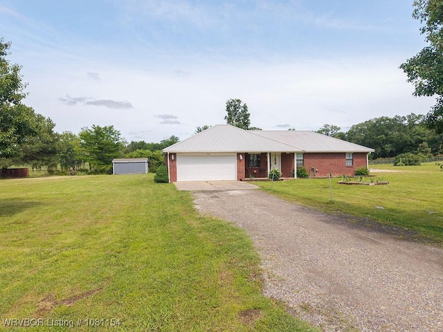 112179 S 4776th Rd, Muldrow, OK 74948 - ranch-style house featuring driveway, a garage, a front yard, and brick siding