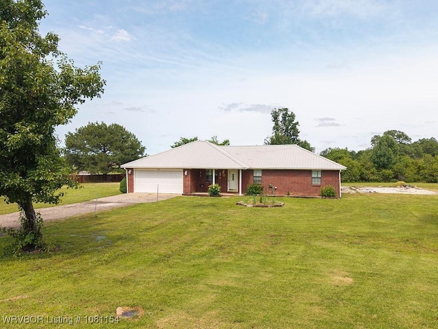 112179 S 4776th Rd, Muldrow, OK 74948 - ranch-style house featuring concrete driveway, an attached garage, a front lawn, and metal roof