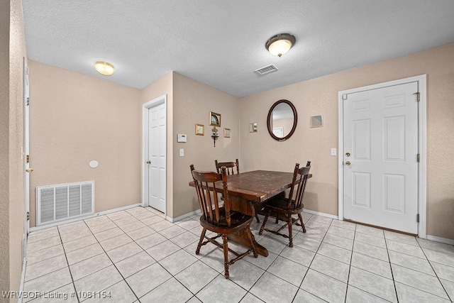 112179 S 4776th Rd, Muldrow, OK 74948 - dining area with light tile patterned floors, a textured ceiling, and baseboards