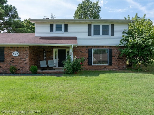 view of property with a patio area and a front yard