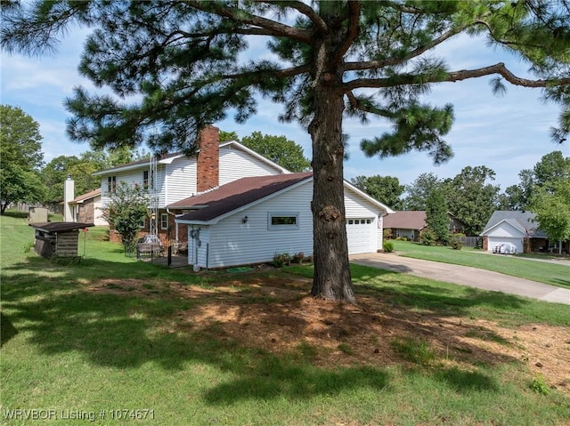 view of home's exterior with a garage and a yard