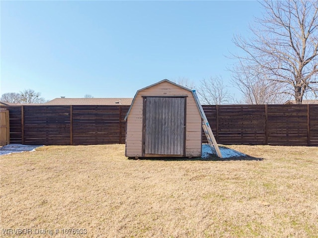 view of shed with a fenced backyard