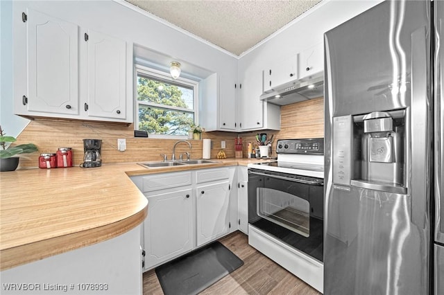 kitchen featuring electric range, stainless steel fridge with ice dispenser, light countertops, under cabinet range hood, and white cabinetry