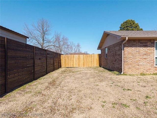 view of yard featuring a fenced backyard