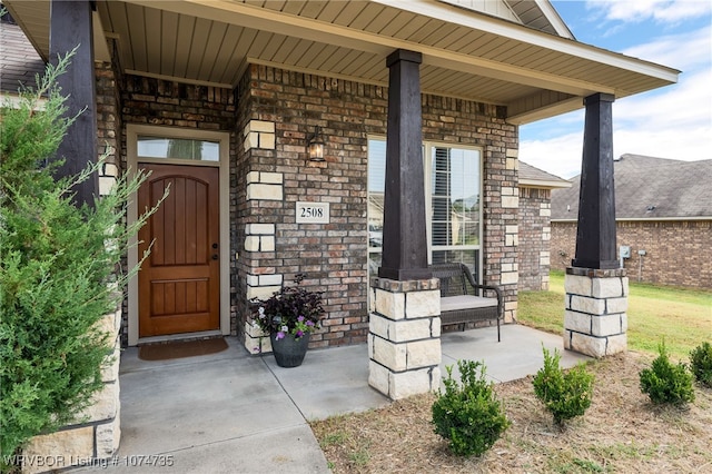 doorway to property with a porch