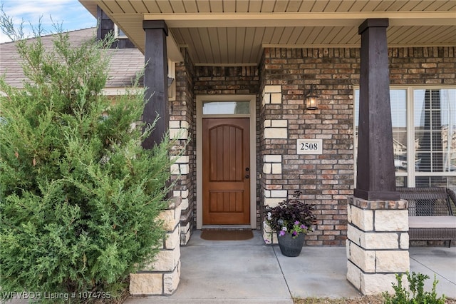 property entrance featuring covered porch