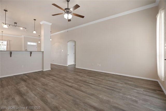 unfurnished living room featuring track lighting, crown molding, ceiling fan, and dark wood-type flooring