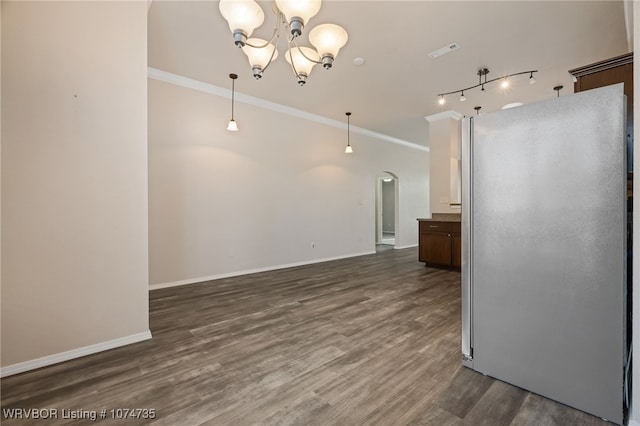 kitchen featuring crown molding, pendant lighting, dark wood-type flooring, and a notable chandelier