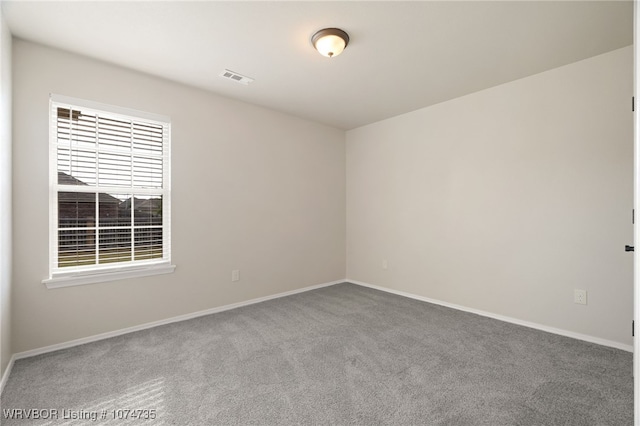 spare room featuring carpet floors