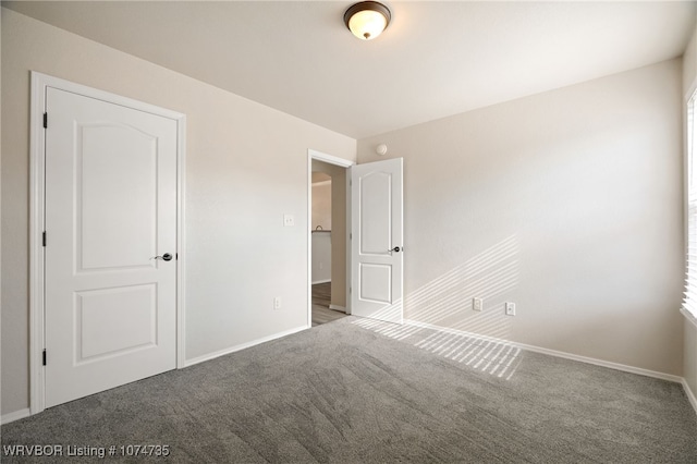 unfurnished bedroom with carpet flooring