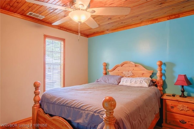 1515 M Cir, Barling, AR 72923 - bedroom with crown molding, wood ceiling, wood finished floors, a ceiling fan, and baseboards