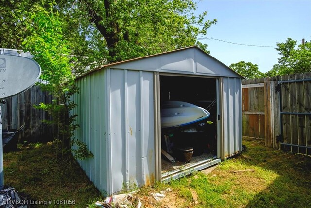 1515 M Cir, Barling, AR 72923 - view of shed featuring a fenced backyard