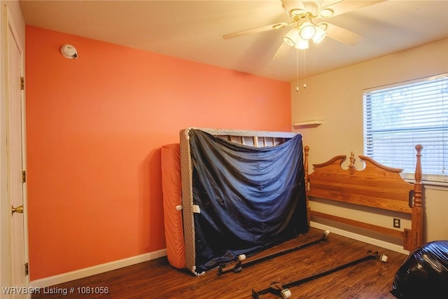 1515 M Cir, Barling, AR 72923 - bedroom featuring wood finished floors, baseboards, and ceiling fan