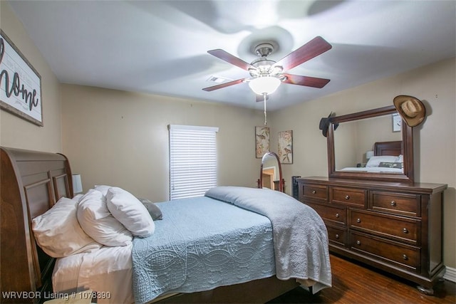 bedroom featuring dark hardwood / wood-style flooring and ceiling fan