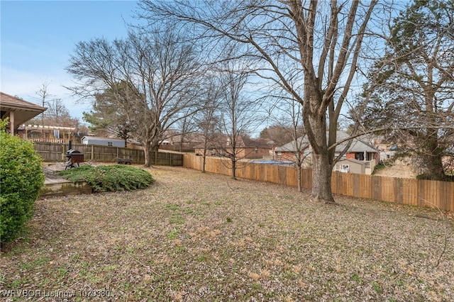 view of yard with a fenced backyard