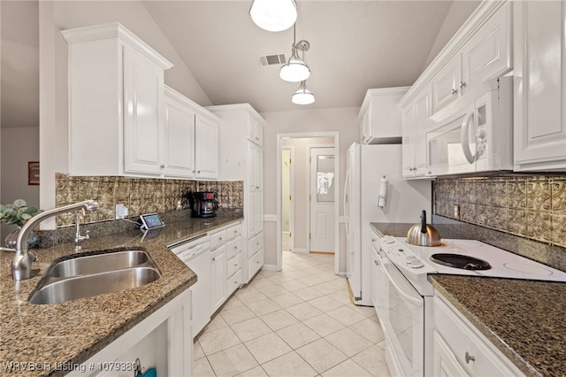 kitchen with visible vents, white cabinets, vaulted ceiling, a sink, and white appliances