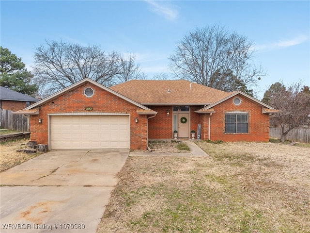 ranch-style home with a garage, brick siding, fence, driveway, and a front lawn