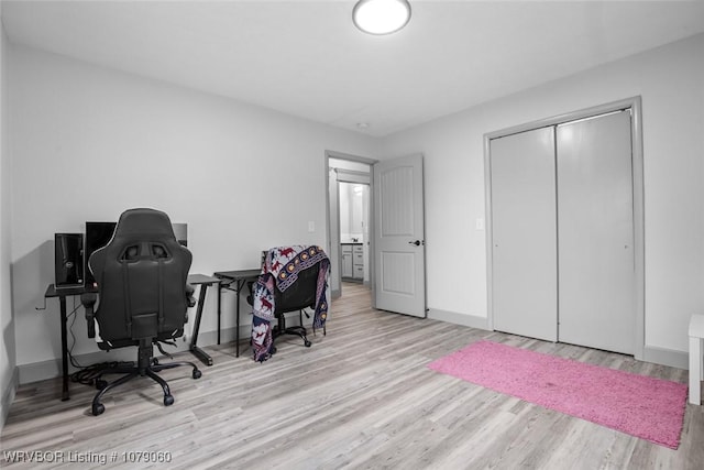 office area featuring wood finished floors and baseboards