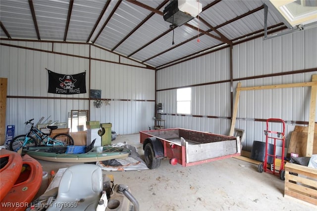 garage featuring metal wall and a garage door opener