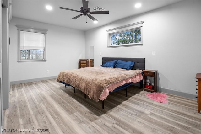 bedroom featuring recessed lighting, wood finished floors, visible vents, and baseboards