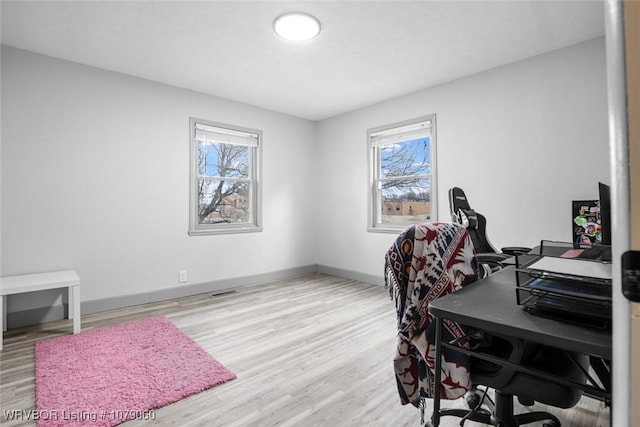 office area with wood finished floors and baseboards