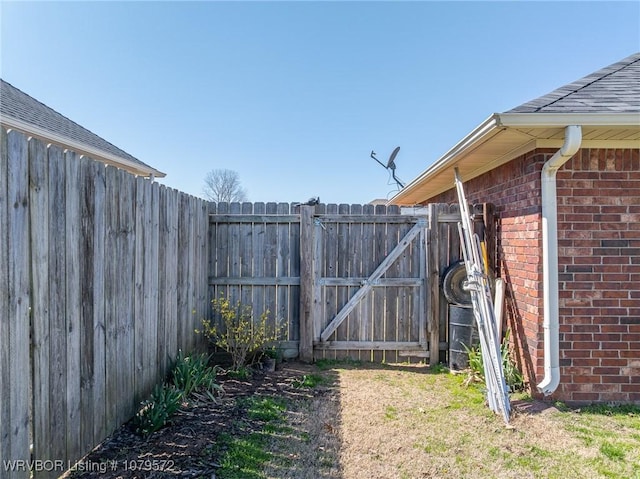 view of yard with a gate and fence