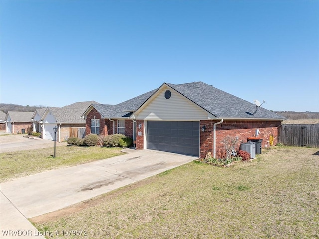 single story home featuring a front lawn, a garage, brick siding, and concrete driveway