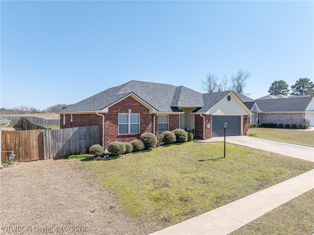 ranch-style house with a front lawn, driveway, fence, a garage, and brick siding