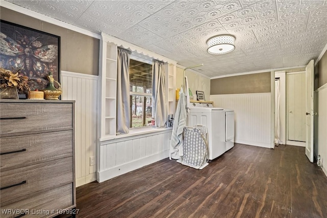 laundry area with a wainscoted wall, an ornate ceiling, washer and dryer, and dark wood-type flooring