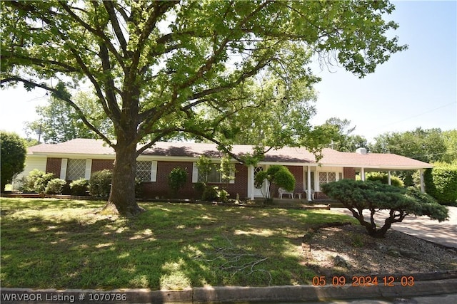 ranch-style house with a front lawn