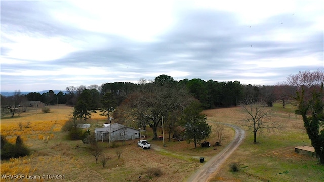 birds eye view of property with a rural view