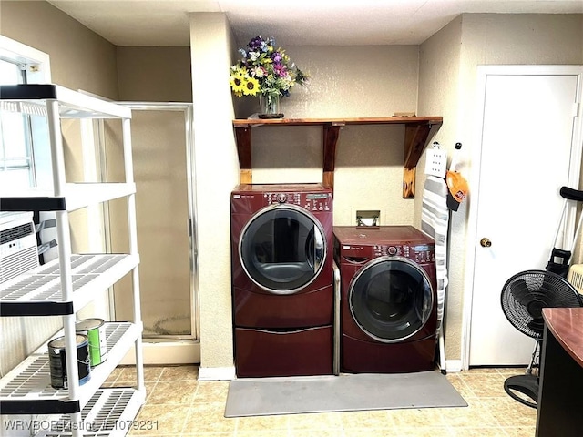 laundry area featuring washing machine and clothes dryer