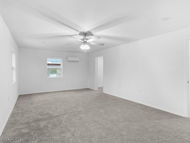 unfurnished room with a wall mounted air conditioner, carpet floors, and ceiling fan